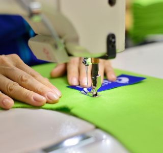 Tailoring Process - Women's hands behind her sewing