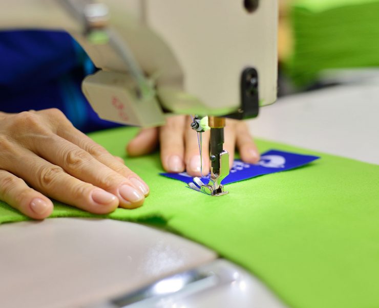 Tailoring Process - Women's hands behind her sewing
