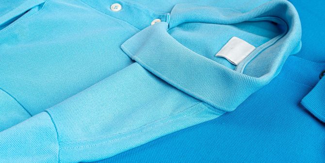 Blue cotton polo t-shirt texture close up. Men's fashion